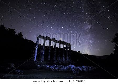 A View Of The Stars Of The Milky Way With A Mountain Top In The Foreground. Night Sky Nature Summer 