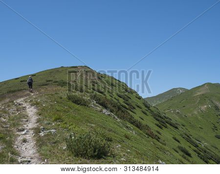 Beautiful Mountain Landscape Of Western Tatra Mountains Or Rohace With Men Hiker With Backpack Hikin