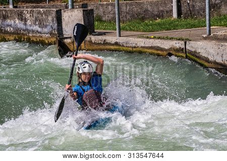 Augsburg, Germany - June 16, 2019: Whitewater Kayaking, Extreme Kayaking. A Guy In A Kayak Sails On 