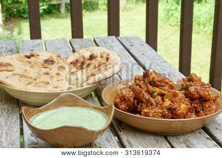 Veiw Of  Homemade Tava Chicken With Green Raita Chutney And Tandoori Roti
