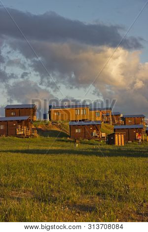 Russia, Republic Of Khakassia, July 2019: Wooden Houses Recreation Bigples On Lake Bele.