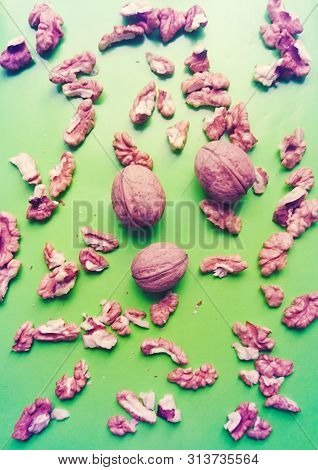 Ripe Walnuts Lie On A Gentle Green Background. Healthy Food For People