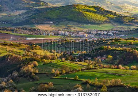 Spring In Slovakia. Meadows And Fields Landscape Near Hrinova. Spring Colored Cherry Trees At Sunset