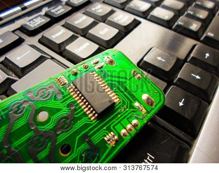 Green Electronic Board On The Keyboard. Repair Of Equipment. System Administrator.