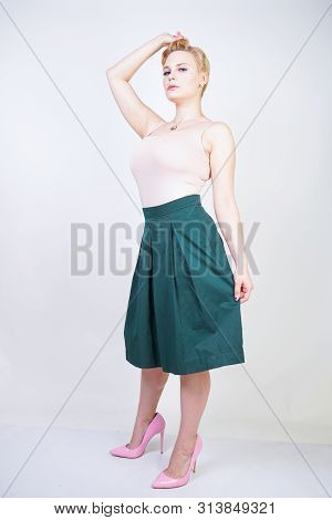 Pin Up Curvy Girl In Green Pleated Midi Skirt On White