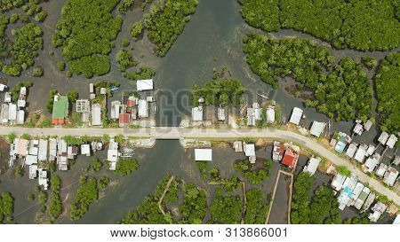 Highway Through The Mangrove Forest Passing Through The Village, Aerial View. Siargao Island, Philip