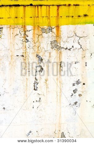 Grungy vanhan muurin ruosteinen keltainen maali