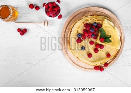 Top View Of Pancakes With Raspberries And Blueberries. Healthy Summer Breakfast,homemade Classic Rus