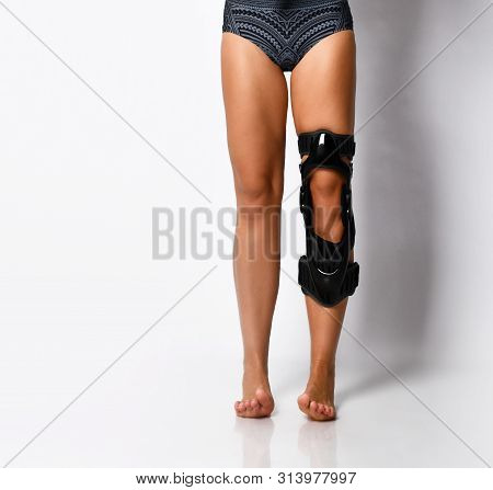 Athletic Woman Leg With A Knee Bandage Playing Sports Gymnastics Yoga, Recovery After Injury. Isolat