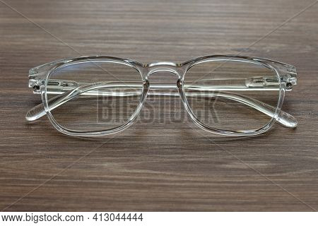 Glasses For Vision With Dioptria On The Wooden Table Office