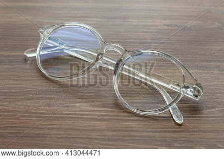 Glasses For Vision With Dioptria On The Wooden Table Office