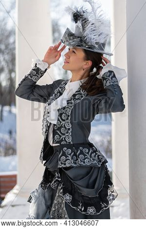 A Woman Dressed As A 19th-century Noblewoman Near The Rotunda