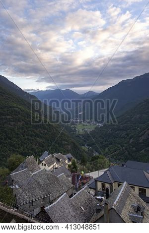 Sunset Aerial View Of The Catalan Pyrenean Village Of Canejan With Bosost In The Background Of The A