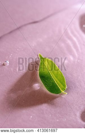 A Drop Of Transparent Cosmetic Gel On A Pink Background