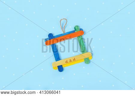 Diy And Kids Creativity. Photo Frame Made From Ice Cream Sticks. Children Craft For Fathers Day. Han