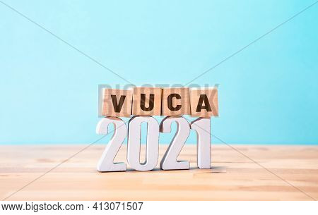 2021 Vuca World Concepts With Text On Wood Block.vision And Change.copy Space