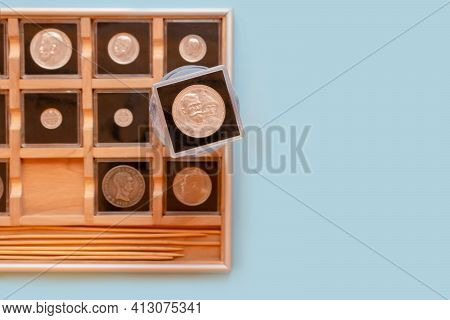 Collection Of Antique Coins In Plastic Cases In Wooden Coin Album. Numismatics Metal Coins In Transp