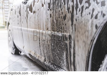 Car Covered With Washing Foam At Contactless Car Washing Service