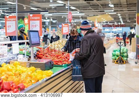 15.02.2021, Russia, Moscow. A Major Supermarket Ashan. Senior Buyer Chooses Vegetables.