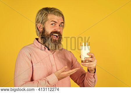 Fermented Foods Healthy Eating Concept. Happy Farmer Present Milk Glass. Bearded Man Drink Useful Mi