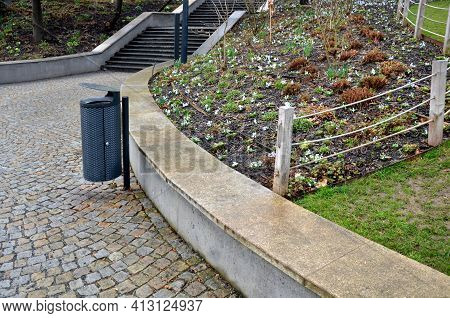 Retaining Wall At The Large Staircase In The Park The Flowerbed Area Is Planted With Rich Greenery O