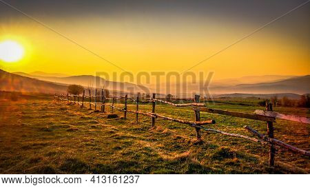 Spring Landscape Of Mountainous Countryside During Sunset