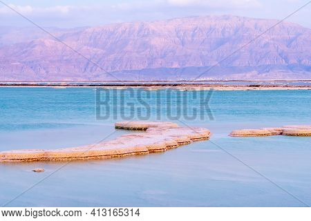 Sunset View Of Salt Formations In The Dead Sea, With The Edom Mountains In The Background. Southern 