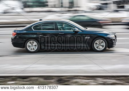 Moscow, Russia - March 2021: Bmw 5 Series On The Road In Motion. Fast Speed Drive On City Road