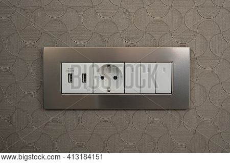 A 220 Volt Euro Standard Socket With Grounding In A Metal Frame And A Usb Charging Socket And Three 