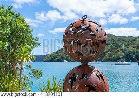 Great Barrier Island New Zealand - February 22 2021; Iron Sculpture With Rusty Patina In Wharf Of Po