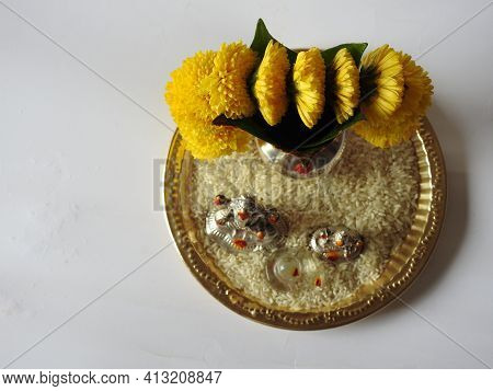 Closeup Of Silver Kalash Decorated With Chrysanthemum Flower, Leaf, Coconut, Kumkum And Turmeric Wit
