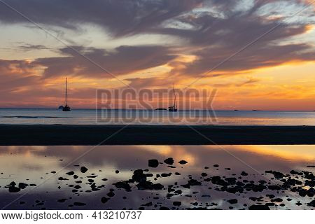 Sunset Patterns As Clouds And Sun Backlight And Brighten Tidal Mulberry Grove Beach On Great Barrier