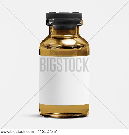Blank white label on amber injection vial glass bottle