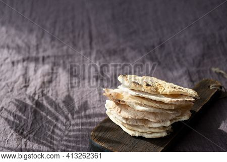 Homemade Matzo  With Microgreen Peas. Unleavened Flatbread Bread. Pesah Celebration Concept.  Jewish