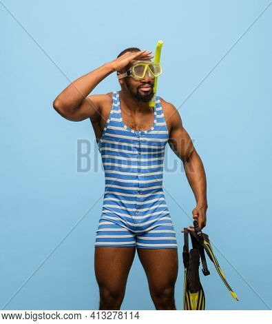 Funny Africam-american Man In Swimming Suit, Goggles Isolated On Blue Background