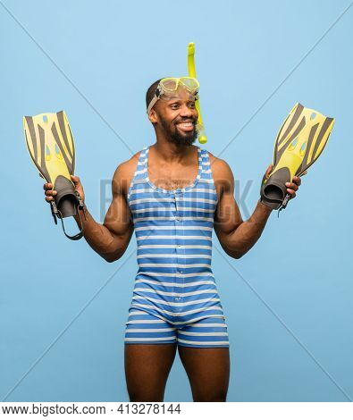 Funny Africam-american Man In Swimming Suit, Goggles Isolated On Blue Background