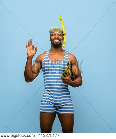 Funny Africam-american Man In Swimming Suit, Goggles Isolated On Blue Background