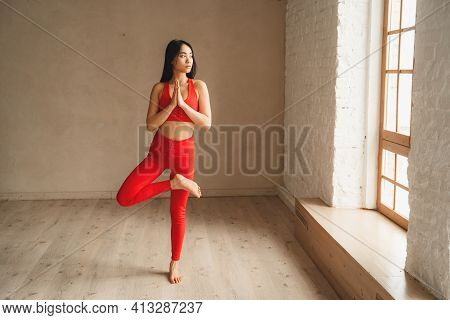 Fit Athletic Woman Doing Yoga, Self Control. Beautiful Women Working Out In Gym Together. Intense Fi