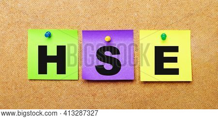 On A Beige Background, Multi-colored Stickers For Notes With The Word Hse