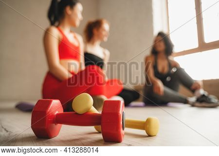 Close Up Photo Of Dumbbells In Gym. Intense Fitness Training Workout In Loft Industrial Gym