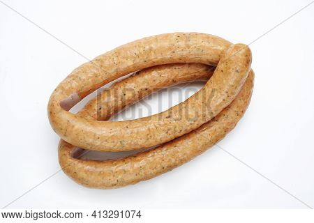 Top View Of Rings Of Aromatic, Country Style, Smoked Sausage, Isolated On A White Background. Tradit