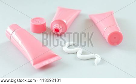 Blank Plastic Tubes With Squeezed Out White Beauty Or Medical Cream