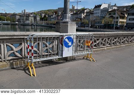Zurich Switzerland - March 10, 2021: Steel Barrier Fence With Traffic Sign Obstacle Right Turn Aroun