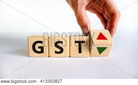 Gst, Goods And Services Tax Symbol. Businessman Holds A Cube With Up And Down Icon. Word 'gst'. Beau