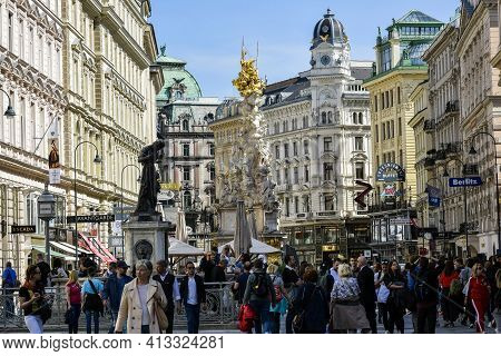 Austria, Vienna- May 2019: Tourists Near Plague Column (holy Trinity Column) On Graben Street In Vie