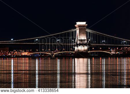 Night Budapest, Chain Bridge On The Danube River, Reflection Of Night Lights On The Water