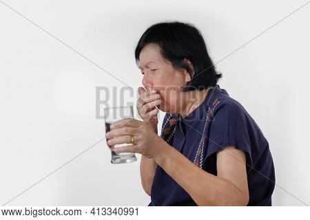 Elderly Woman Choking A Water Drink After Take  Medicine ,isolated On White Background.