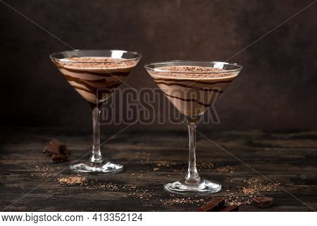 Chocolate Truffle Martini Cocktail On Dark Wooden Background, Copy Space. Mudslide Truffletini Cockt