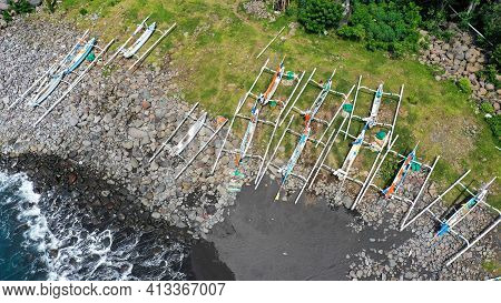 Top Down Aerial Of Traditional Jukung Boats Resting On Beach In Bali. Amed Beach In Bali Indonesia W