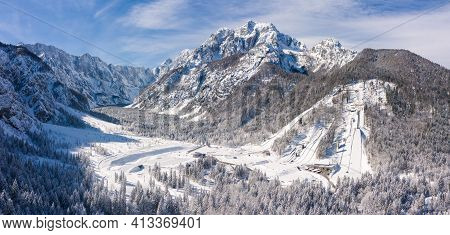 Aerial View Of Ski Jump In Planica, Slovenia At Ratece Near Kranjska Gora In Winter With Snow.